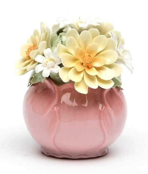 A product line showing a mix of porcelain mugs and stoneware bowls